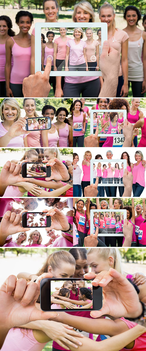Stock Photo Composite image of hand holding tablet pc showing photograph of breast cancer activists